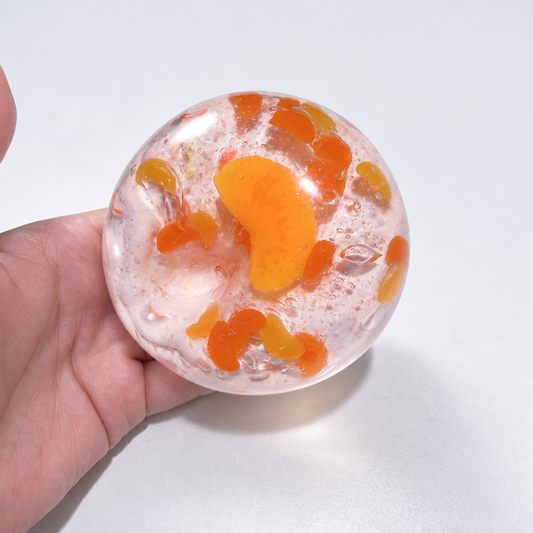 Warm orange sensory squishy ball with resin citrus slice details; Sunset Orange Sea handmade sensory squishy ball, product photo 2