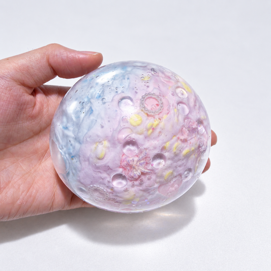 Pale pastel sensory squishy ball with delicate resin inclusions in pink, blue, and lavender tones; Pink Blue Dream handmade sensory squishy ball, product photo 2
