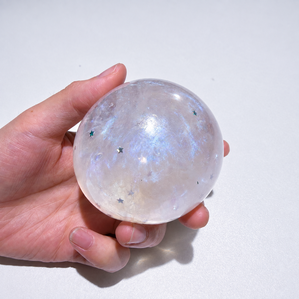 Translucent sensory squishy ball with resin star details and pearlescent shimmer; Glass Galaxy handmade sensory squishy ball, product photo 2