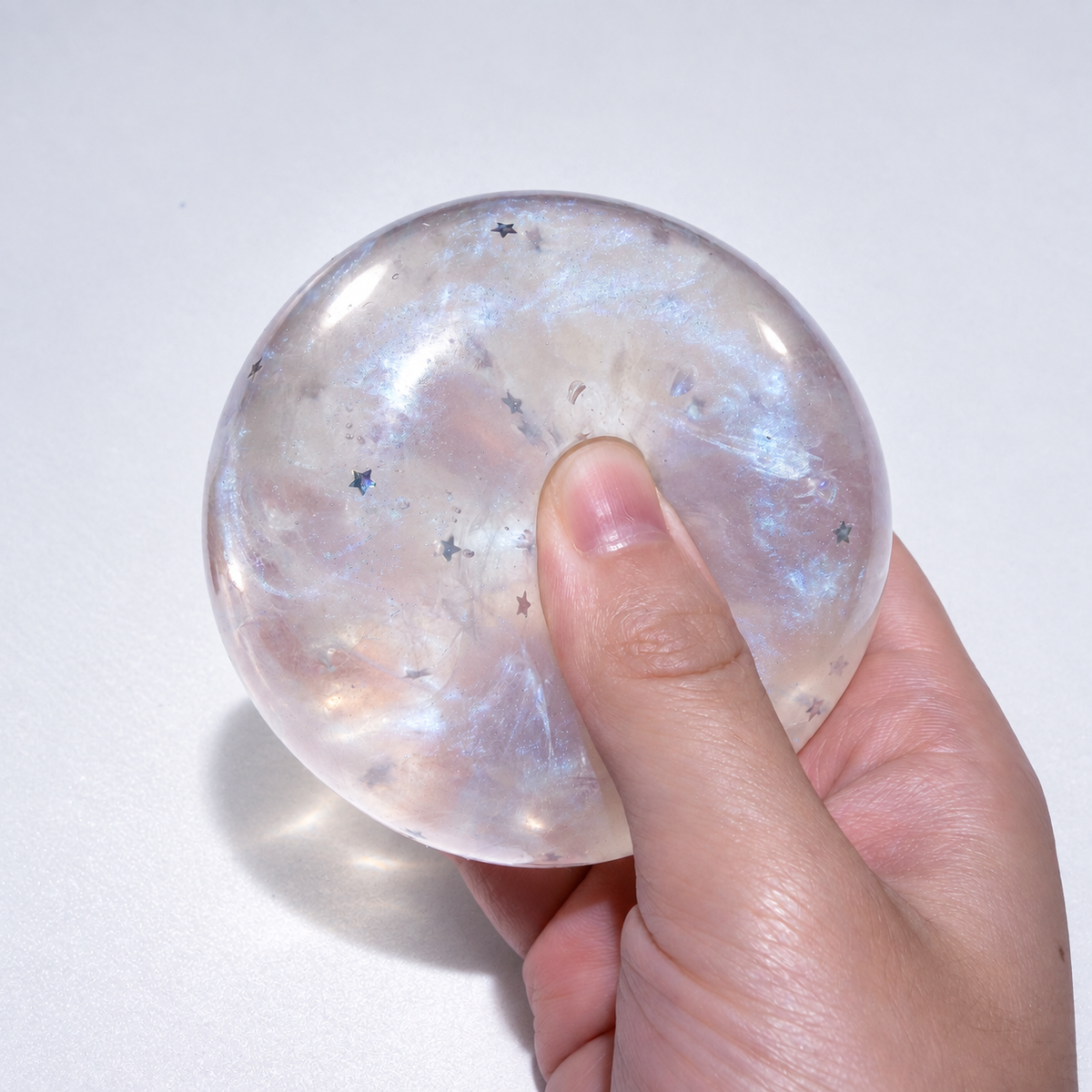 Translucent sensory squishy ball with resin star details and pearlescent shimmer; Glass Galaxy handmade sensory squishy ball, product photo 3