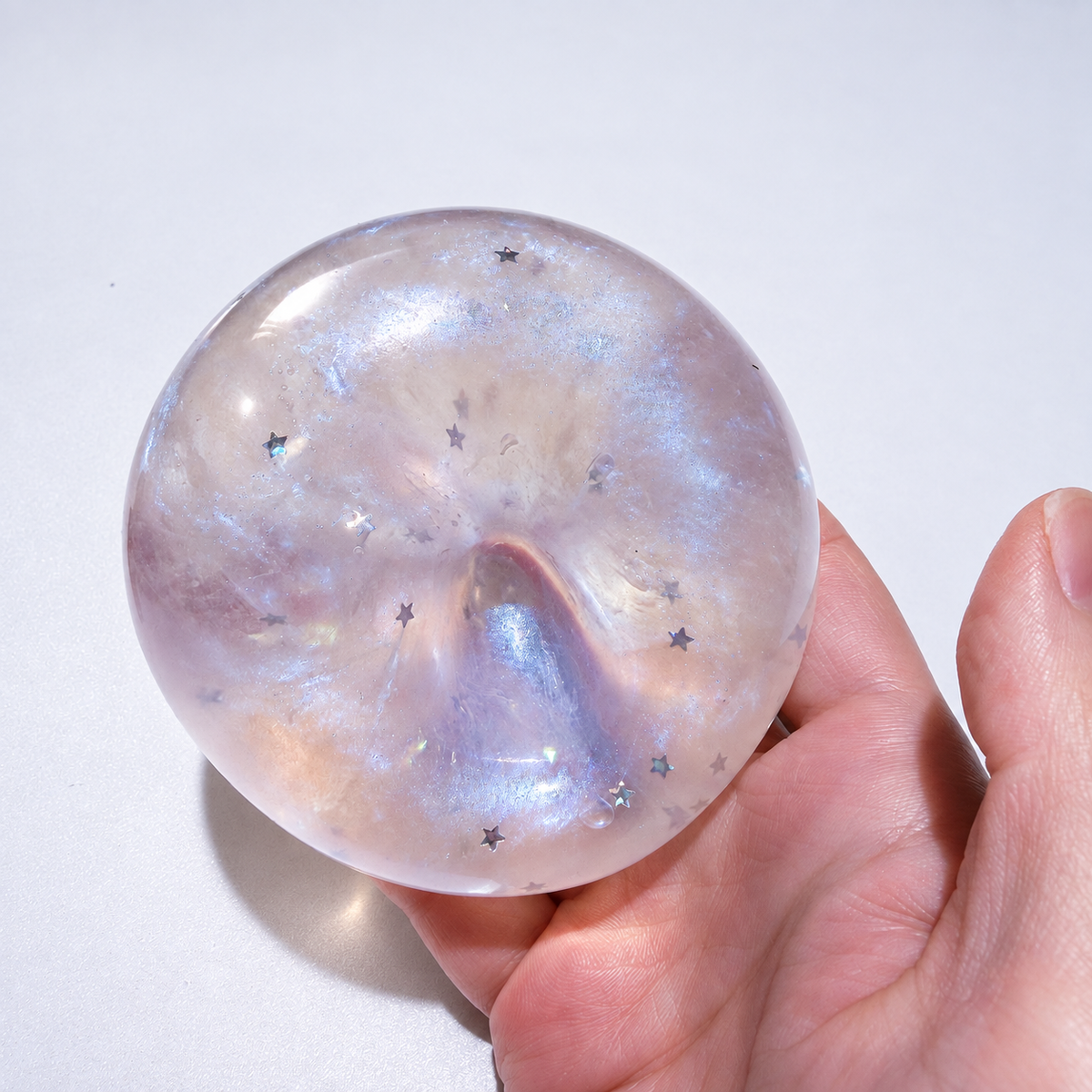 Translucent sensory squishy ball with resin star details and pearlescent shimmer; Glass Galaxy handmade sensory squishy ball, product photo 4