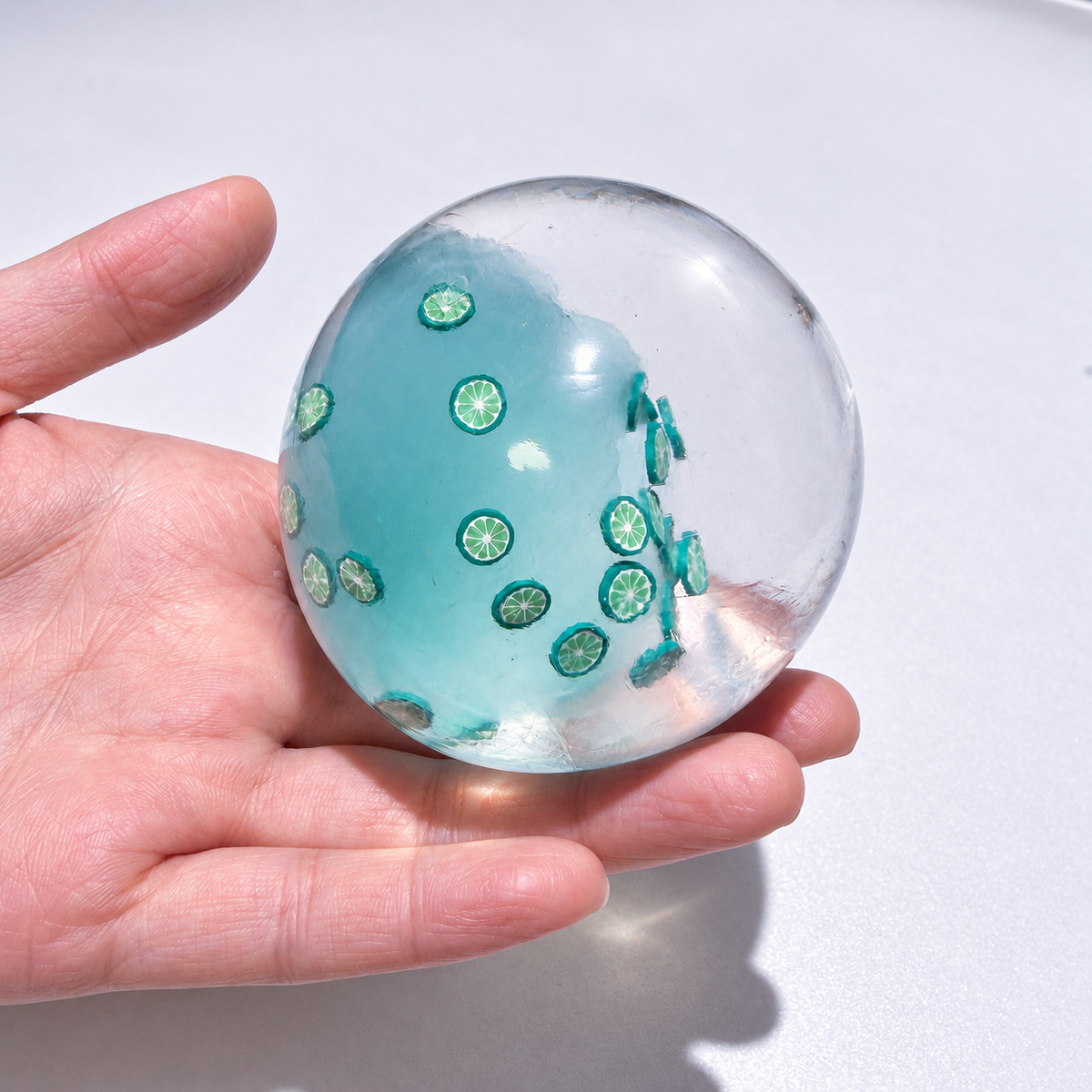 Translucent sensory squishy ball with small resin lemon slice details; Summer Fruit Party handmade sensory squishy ball, product photo 10