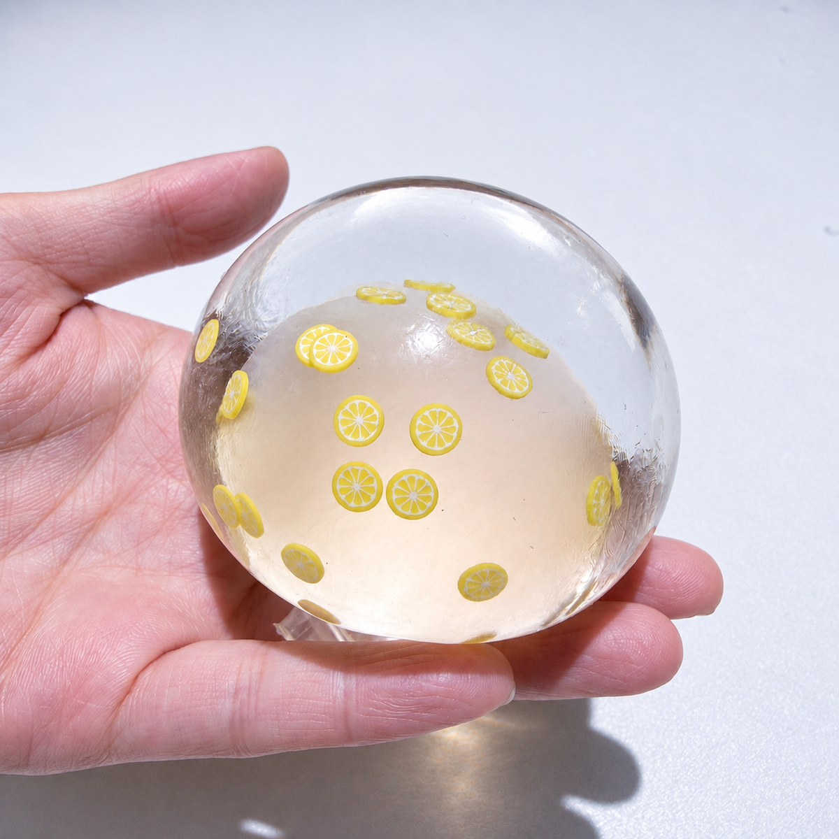 Translucent sensory squishy ball with small resin lemon slice details; Summer Fruit Party handmade sensory squishy ball, product photo 12