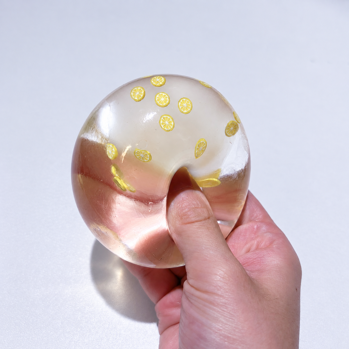 Translucent sensory squishy ball with small resin lemon slice details; Summer Fruit Party handmade sensory squishy ball, product photo 2