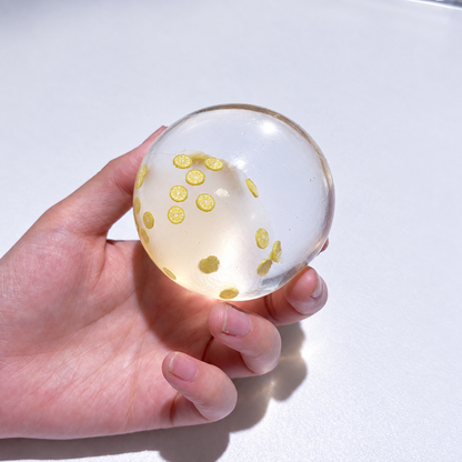 Translucent sensory squishy ball with small resin lemon slice details; Summer Fruit Party handmade sensory squishy ball, product photo 5
