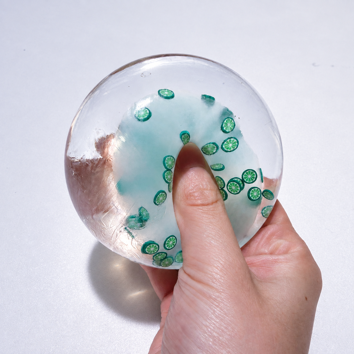 Translucent sensory squishy ball with small resin lemon slice details; Summer Fruit Party handmade sensory squishy ball, product photo 6