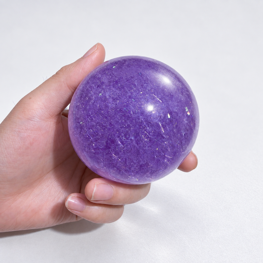 Purple ball with fine transparent decorative strips visible inside